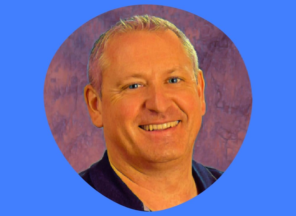 Photo of James Williams on a blue background