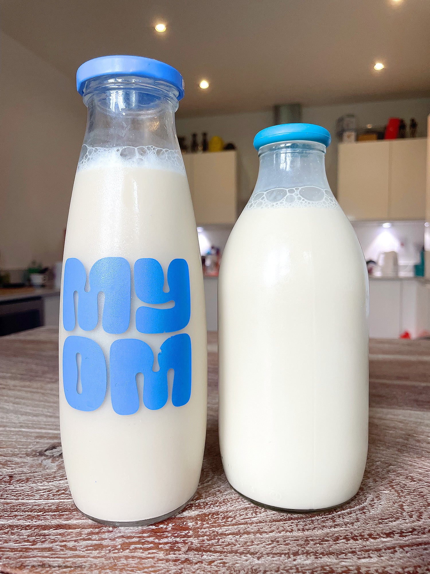 Two bottles of MYOM oat milk mixed ready to drink