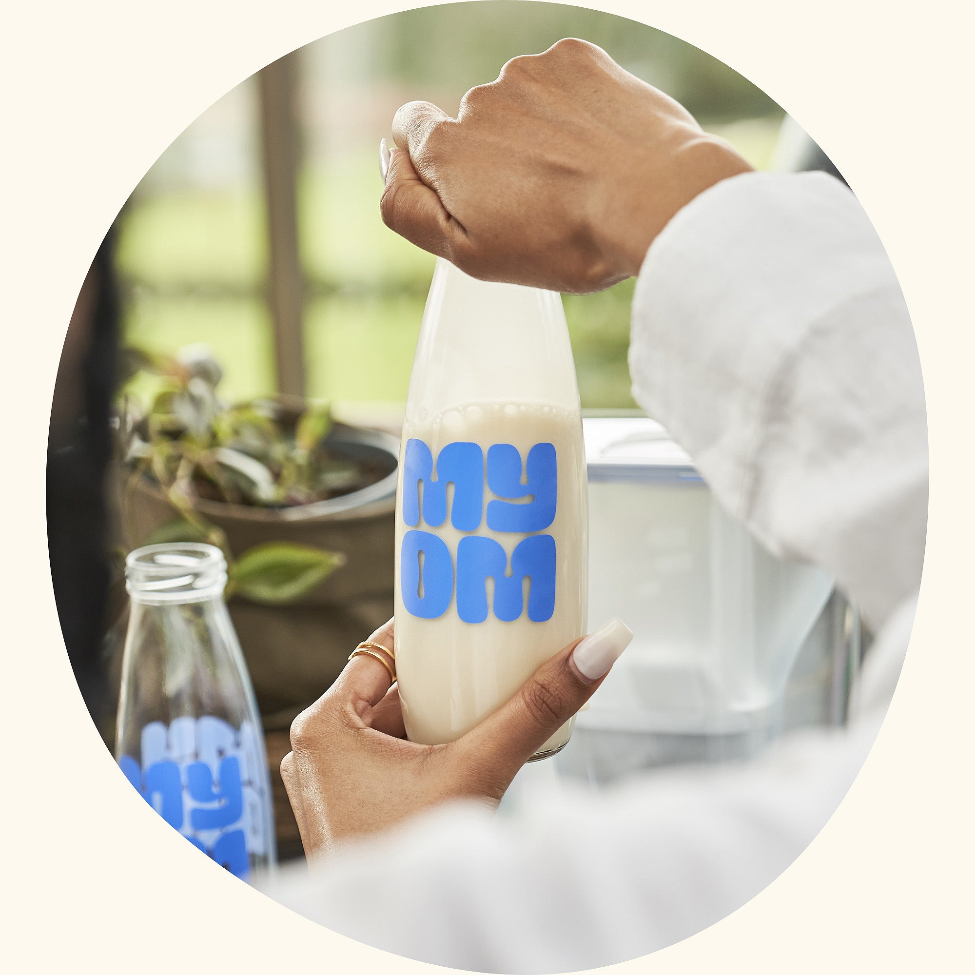 photo of MYOM vegan milk in a glass bottle