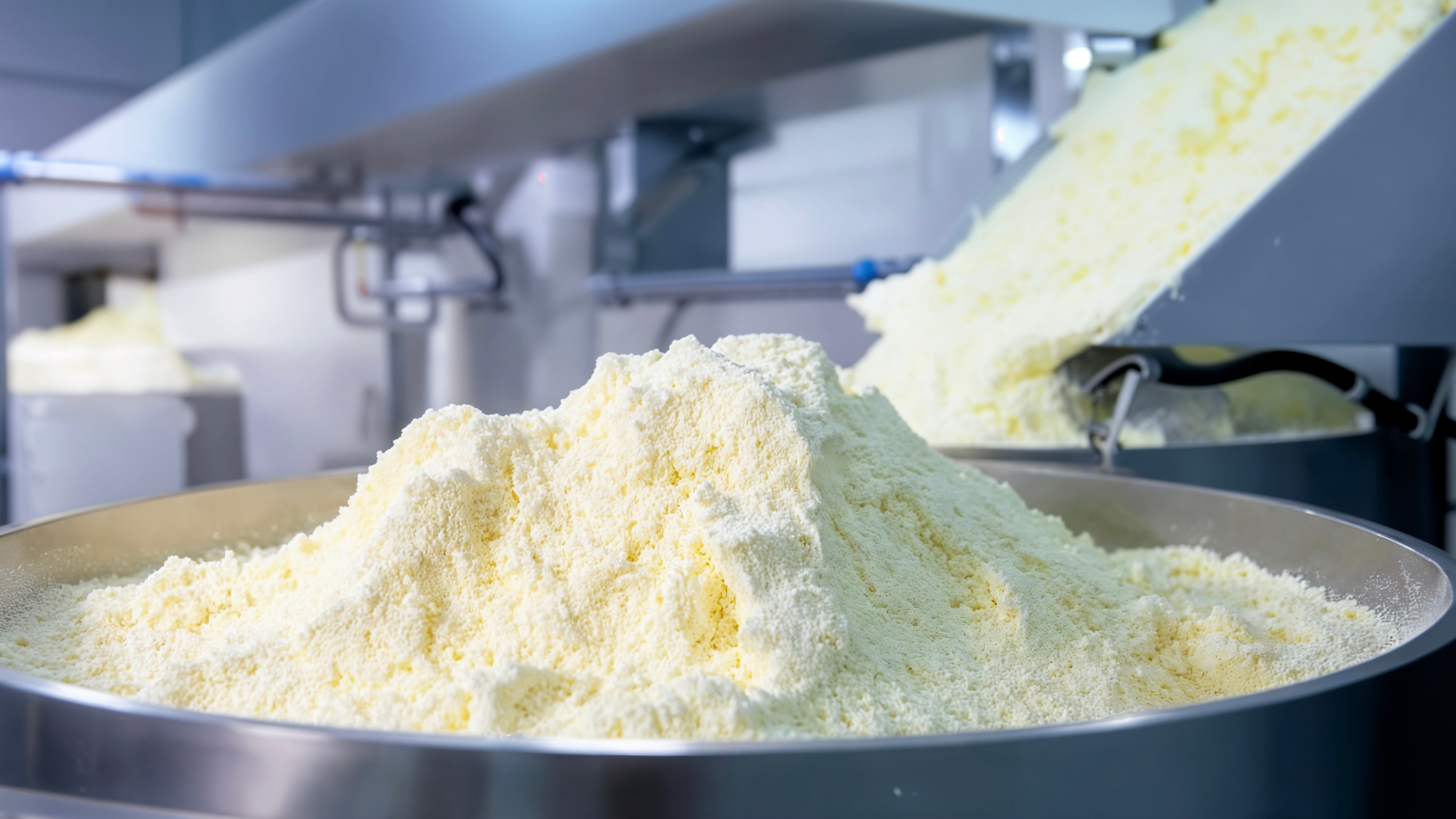 Oat milk powder being produced through industrial drying equipment.