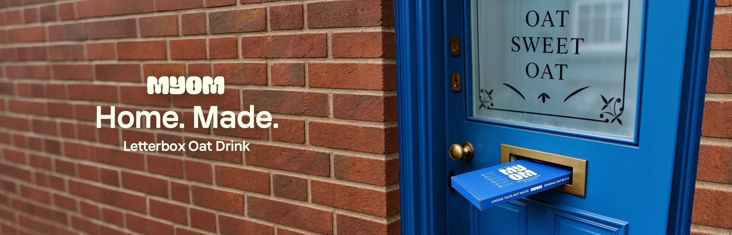  MYOM Original Oat Anywhere 6 Pack posting through a blue front-door letterbox — Home. Made. Letterbox Oat Drink