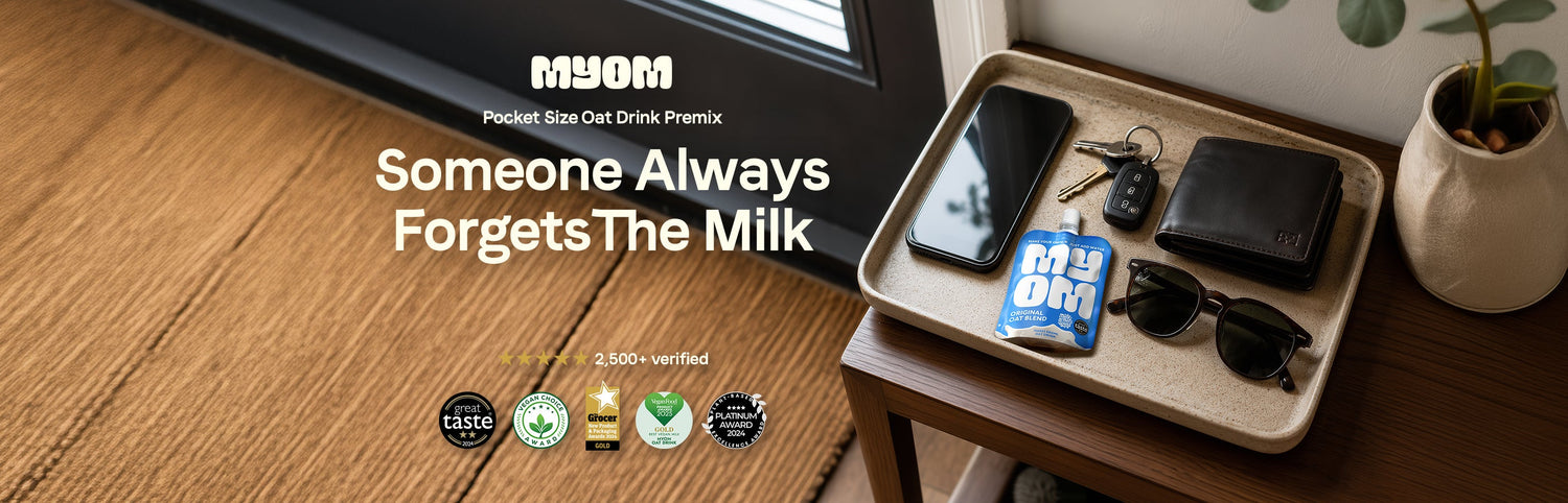 MYOM Original Oat Anywhere pouch in a tray of valuables including a phone, keys and wallet by a front door inside a house — Someone always forgets the milk.