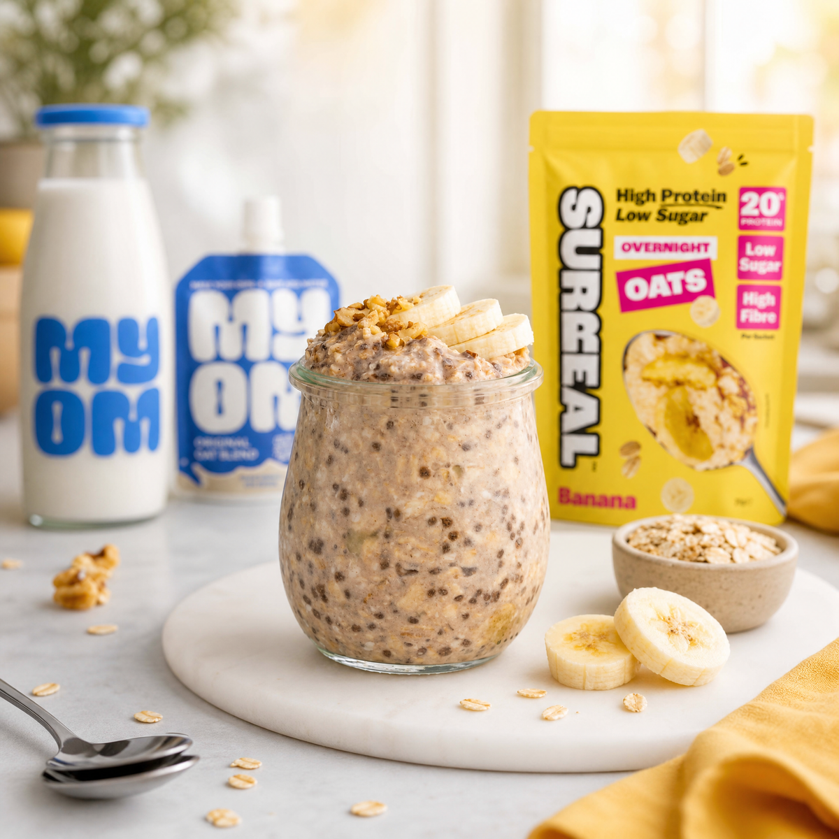 Surreal Banana Overnight Oats made with MYOM Original oat drink with fresh banana slices and walnuts, a naturally sweet low sugar breakfast.
